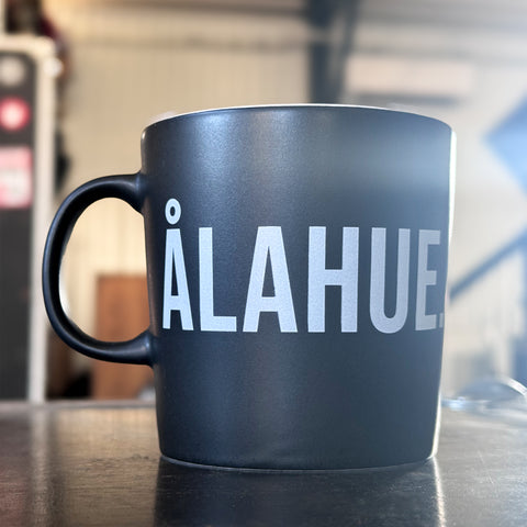 ÅLAHUE. [MUGG]